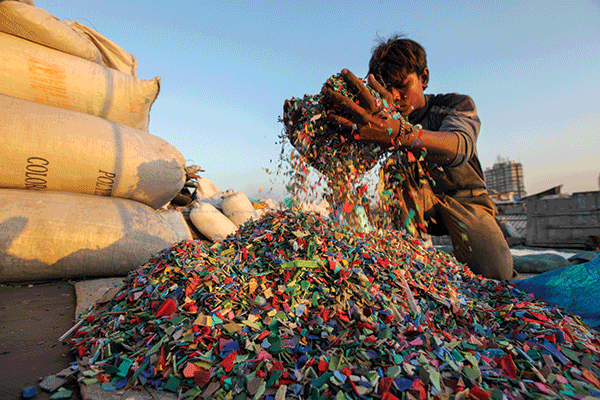 Mumbai, Maharashtra, India. Plastic recycle units in Asia’s largest slum. Last year, India passed legislation prohibiting businesses from using single-use plastics to combat its plastic waste problem.